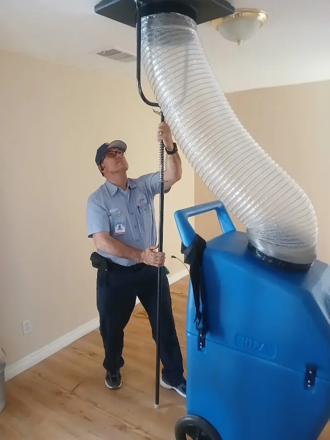Furnace Tune-Up technician using HEPA equipment in Catonsville